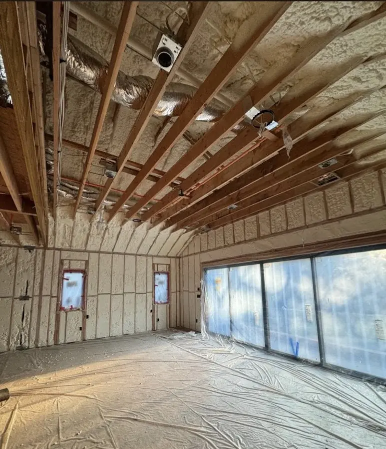 Interior walls and ceiling insulated with spray foam during new construction in The Meadows